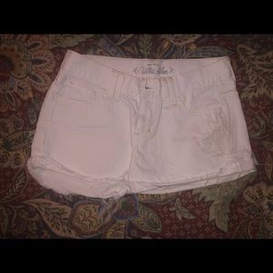 White distressed shorts